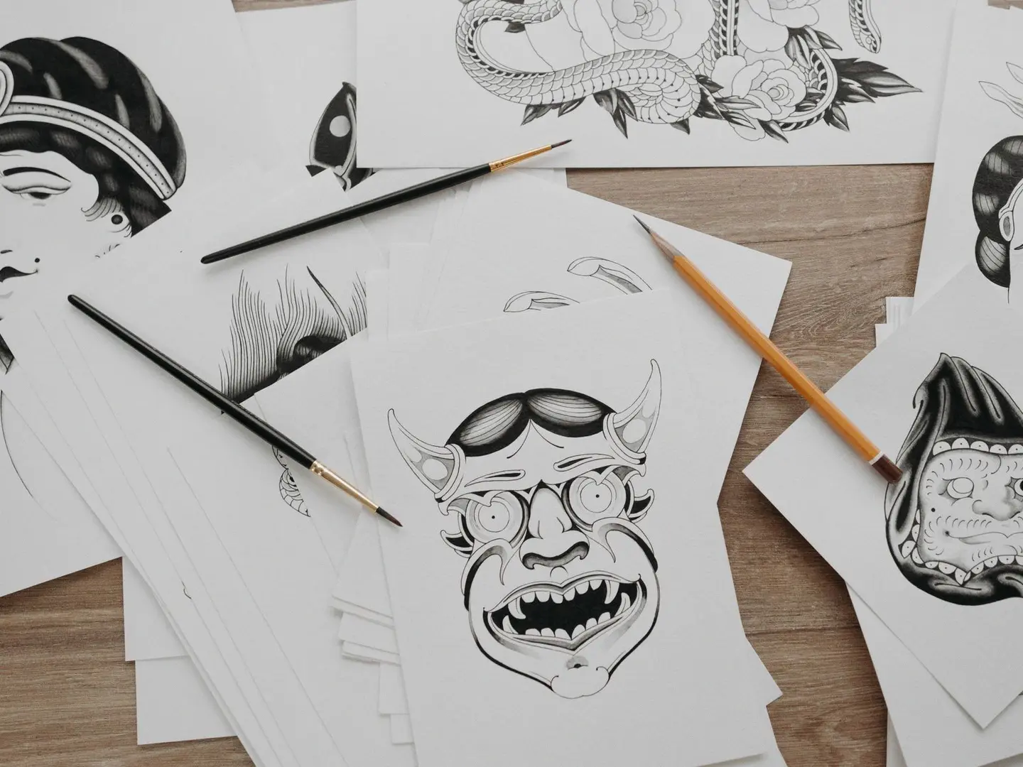 Sketches and finished illustrations on the studio desk